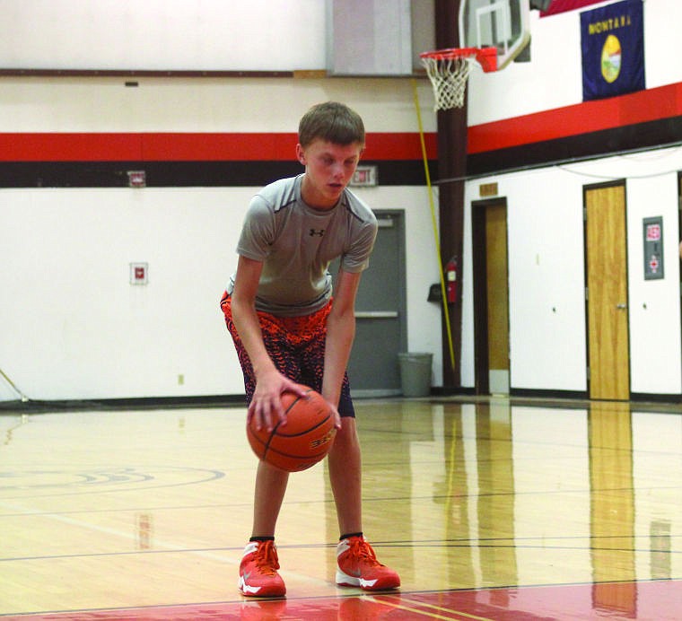 &lt;p&gt;Kyle Weeks of the Plains Horsemen gears up for a free throw shot during the team's scrimmage against the St. Regis Tigers on Tuesday evening. Plains won the exhibition 57-33.&#160;&lt;/p&gt;