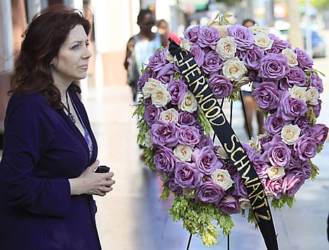 &lt;p&gt;Sherwood Schwartz's great niece, Robin Randall, pauses next to flowers set at his star on the Hollywood Walk of Fame Tuesday in Los Angeles.&lt;/p&gt;