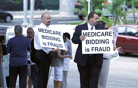 &lt;p&gt;Demonstrators stand outside the Health Care Fraud Prevention Summit, Friday, July 16, 2010 where Attorney General Eric Holder and Health and Human Services Secretary Kathleen Sebelius were speaking in Miami.&lt;/p&gt;