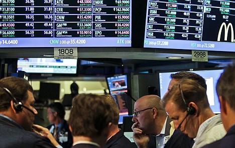 &lt;p&gt;FILE- In a July 13, 2012, file photo, traders work as the New York Stock Exchange nears closing. JPMorgan Chase blew away a cloud of concern hanging over the banking industry Friday and set off a rally in stocks. (AP Photo/Bebeto Matthews)&lt;/p&gt;