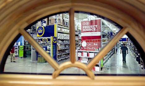 &lt;p&gt;In this Tuesday, June 19, 2012, photo, a shopper is seen through a window on display at a Lowe's store in Atlanta. Americans cut their spending at retail businesses for a third straight month, as a weak job market made consumers more cautious. Retail sales fell 0.5 percent in June from May, the Commerce Department said Monday, July 16, 2012. Consumers spent less on autos, furniture, appliances, building and garden supplies and other items from department stores. (AP Photo/David Goldman)&lt;/p&gt;