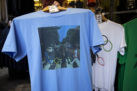 &lt;p&gt;In this photo taken Monday, July 16, 2012, a t-shirt with featuring the cover photograph from the album &quot;Abbey Road&quot; printed on it, shows The Beatles holding Olympic rings as they walk across the zebra crossing as it sold at a London market. The guardians of the games are vigilant about protecting the integrity - and the commercial clout - of the Olympic brand. But even they can't stop the irreverent spirit of artists and craftspeople, who have responded to the games with a cheeky mix of celebration, skepticism and satire. (AP Photo/Matt Dunham)&lt;/p&gt;