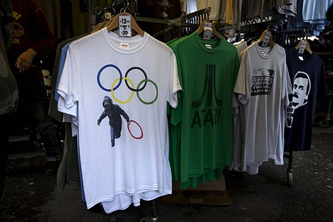 &lt;p&gt;In this photo taken Monday, July 16, 2012, a t-shirt depicting a rioter holding an Olympic ring is displayed on sale in a London market. The guardians of the games are vigilant about protecting the integrity - and the commercial clout - of the Olympic brand. But even they can't stop the irreverent spirit of artists and craftspeople, who have responded to the games with a cheeky mix of celebration, skepticism and satire. (AP Photo/Matt Dunham)&lt;/p&gt;