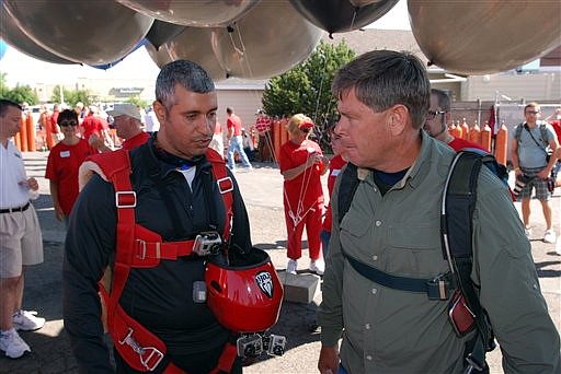 &lt;p&gt;This July 14, 2012 file photo shows gas station owner Kent Couch, right, conferring with Iraqi adventurer Fareed Lafta before taking off from Bend, Ore., in tandem lawn chairs suspended from helium-filled party balloons. The men said Tuesday after hitting thunderstorms about about 14,000 feet, they considered bailing out, but decided to land, coming down safely in a hay field about 40 miles from their starting point. (AP Photo/Jeff Barnard, File)&lt;/p&gt;