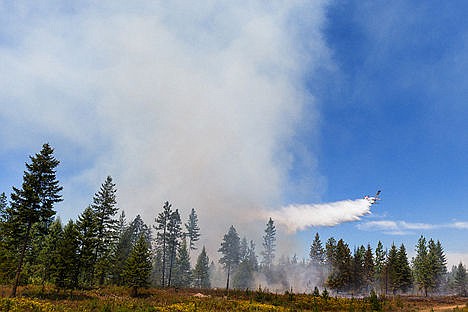 &lt;p&gt;A single engine air tanker drops water on the wildland fire near Spirit Lake.&lt;/p&gt;