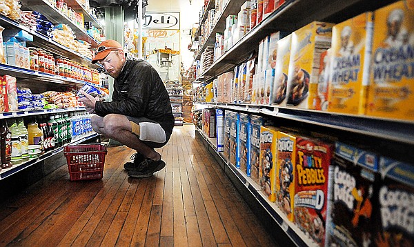 &lt;p&gt;DeGraw carefully chooses his food at the Glacier Park Trading
Company in East Glacier.&lt;/p&gt;