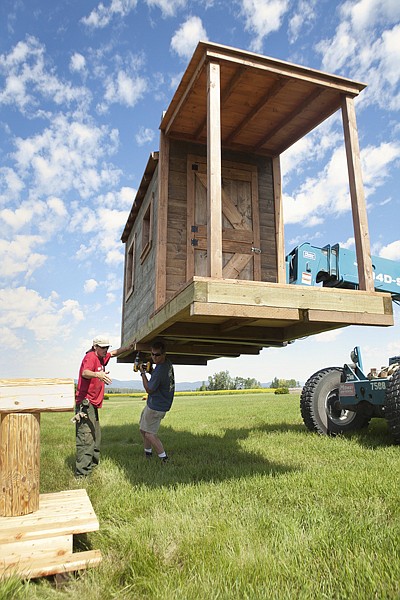 &lt;p&gt;John Kelly (left) and Bert Wood screw risers onto what will be
the post office in the western town area that will be part of The
Event at Rebecca Farm.&lt;/p&gt;