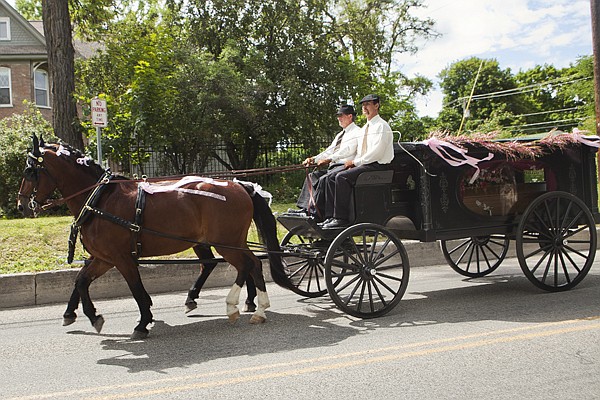 &lt;p&gt;A horse-drawn hearse in the funeral procession for Rosalie
Heinecke, 69, travels down Second Street East toward Conrad
Cemetery Thursday morning.&lt;/p&gt;