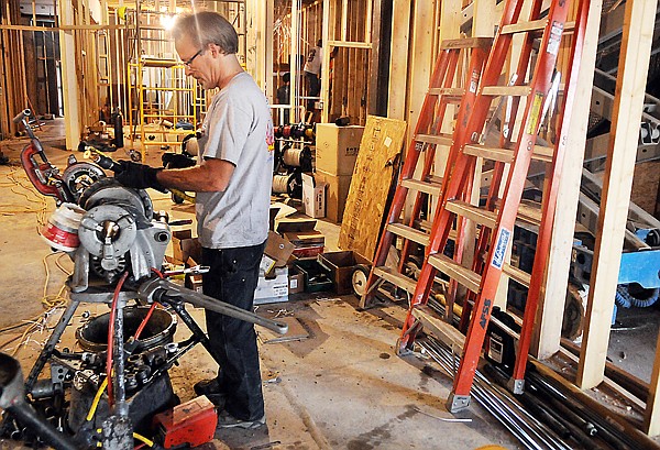 &lt;p&gt;Steve Neblock of Automatic Fire System Service works on the
first floor of the Sykes building on Thursday in Kalispell. Four
floors are currently under construction. When complete hey will
house a market as well as apartments.&lt;/p&gt;