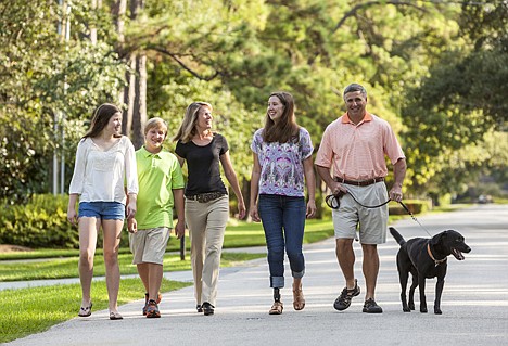 &lt;p&gt;In this Sept. 30, 2013 photo, Memorial High School volleyball player Abby Mueller, who lost part of her right leg in a boating accident, walks with her family in their Houston neighborhood. From left are Emma; Ben; mother, Valerie; Abby; father, Rob; and &quot;Cooper&quot; their dog.&lt;/p&gt;