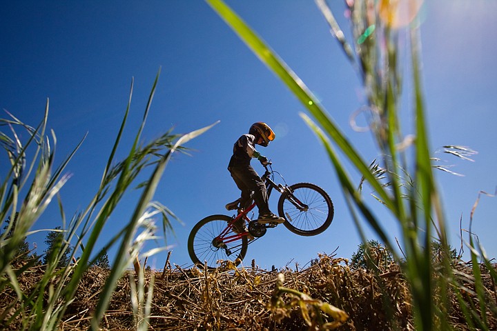 &lt;p&gt;SHAWN GUST/Press Riley Litz, of Post Falls, jumps a section whoops on the BMX track at Cherry Hill on Thursday in Coeur d'Alene.&lt;/p&gt;