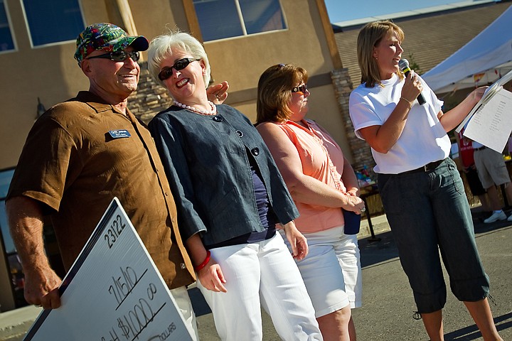 &lt;p&gt;JEROME A. POLLOS/Press Mary Larson is congratulated by Ron Ouren, vice president of Panhandle State Bank following her being named by Ann Siebert, right, as the Panhandle State Bank Community Star during an event Thursday in Coeur d'Alene. Larson was nominated by Melanie Chun, second from right, and her husband Dr. Eric Chun, for her &quot;amazing dedication to the many community and educational missions&lt;/p&gt;