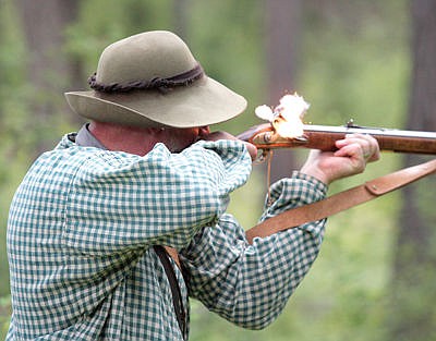 &lt;p&gt;Mike &quot;Lone Oak&quot; Tomell fires his custom made Grady Kerr .62 cal. flintlock rifle Saturday during Rendezvous 2016 at Fawn Creek Campground. (Paul Sievers/The Western News)&lt;/p&gt;