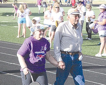 &lt;p&gt;Louise and Walter Schock of St. Ignatius join hands as they walk the survivor&#146;s lap at the start of last Friday&#146;s Relay for Life in Ronan. Louise overcame breast cancer 41 years ago, and has participated in the relay for many years.&lt;/p&gt;