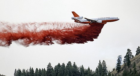 &lt;p&gt;A DC-10 air tanker drops fire retardant over a wildfire Saturday near Carlton, Wash.&lt;/p&gt;