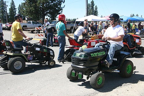&lt;p&gt;Michael Cover, right, of Spirit Lake cruises back into the line-up Sunday on his custom mower, the &#147;Turfinator,&#148; after a time trial in the Big Back-In lawn mower races during Rathdrum Days.&lt;/p&gt;