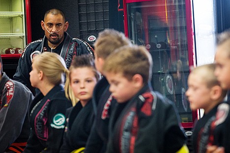 &lt;p&gt;Derek Cleveland, coach at the Iron Lion Jiu-Jitsu Academy, addresses young student during class Thursday at the Dalton Gardens training facility. Cleveland has been diagnosed with a rare pulmonary condition that requires a high-cost surgery.&lt;/p&gt;