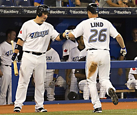 &lt;p&gt;Toronto Blue Jays' Travis Snider, left, congratulates Adam Lind after his solo home run during the seventh inning of a baseball game against the Seattle Mariners in Toronto on Wednesday, July 20, 2011. (AP Photo/The Canadian Press, Frank Gunn)&lt;/p&gt;