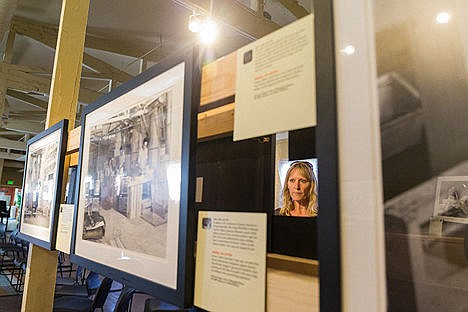 &lt;p&gt;Avery Schuldhaus browses the &#147;Uprooted&#148; exhibit photographs.&lt;/p&gt;