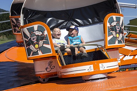 &lt;p&gt;Austin Bergen, 3, left, and Jullian Mendoza, 4, laugh as they spin around on the tilt-a-whirl at Rathdrum Days.&lt;/p&gt;