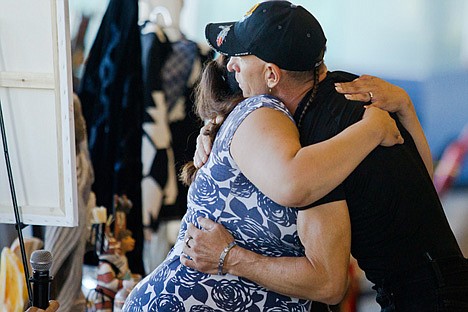 &lt;p&gt;RJ Molinere, right, from the show Swamp People, embraces Shaina Nomee, left, after the Swamp People question and answer session at the 2012 Julyamsh Powwow in Post Falls Friday night.&lt;/p&gt;