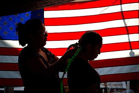 &lt;p&gt;Trista, left, and daughter Nakomi Mike, right, prepare for the beginning ceremony of the 2012 Julyamsh Powwow Friday evening. Nakomi, like many of the performers at Julyamsh, has been dancing in such ceremonies for as long as she can remember.&lt;/p&gt;