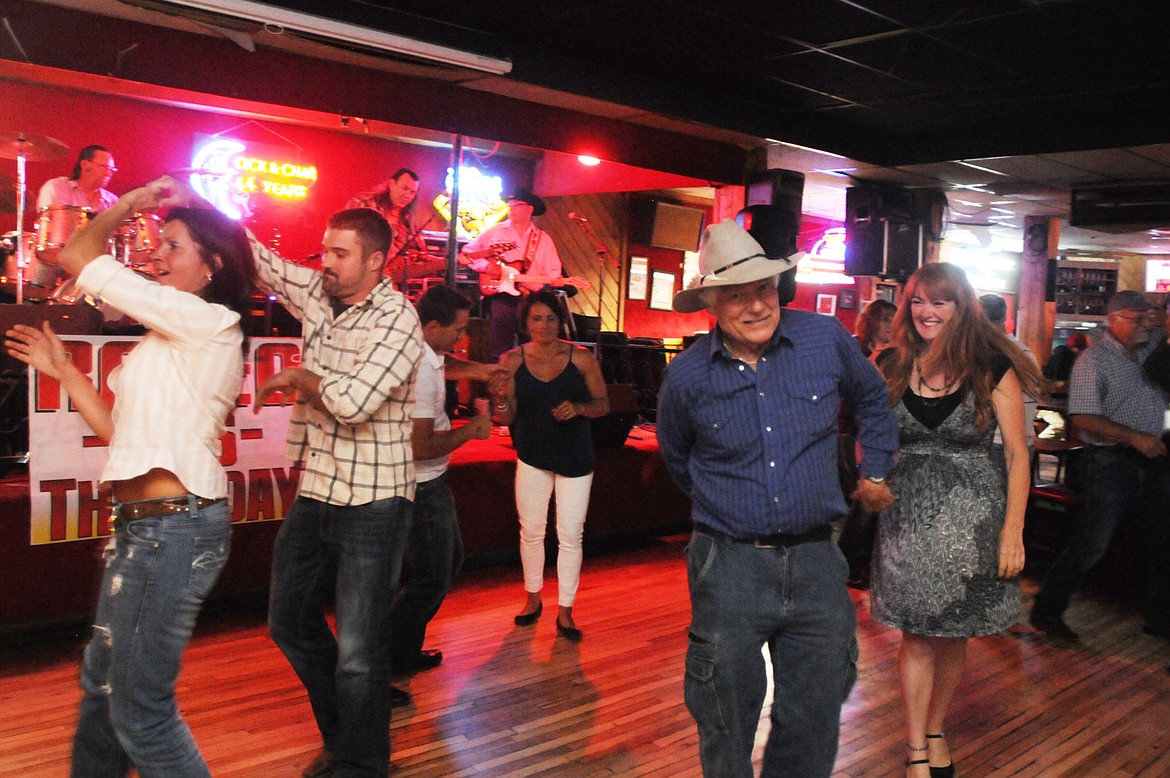 &lt;p&gt;People dance to live music at the Blue Moon on Saturday.&lt;/p&gt;