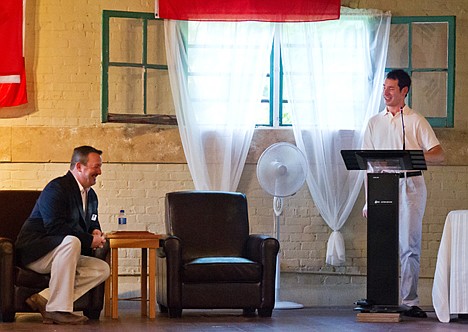 &lt;p&gt;Mike Kralicek, a former Coeur d'Alene Police officer who was shot while on duty in 2004, jokes with Thomas Carter, executive director for the Human Rights Education Institute, while delivering a speech during a social event Friday to promote the center's work in human rights.&lt;/p&gt;