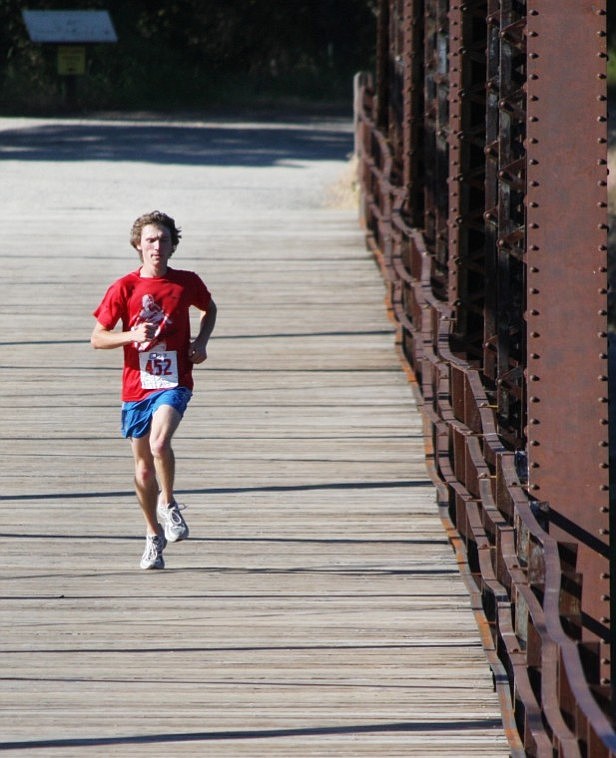 Jacob Naegeli runs across the High Bridge, coming in first place at the fun run.