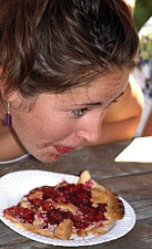 17-year-old Marlee Berry, of Polson, looks at her opponents' progress during the adult pie-eating contest at the CherryFestival last weekend in Polson.