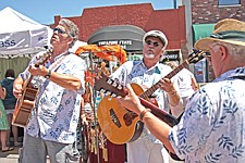 Nick Terhaar, Steve Riddle and Greg Devlin, all of Polson, perform as members of the Singing Sons of Beaches band during the Cherry Festival last weekend in Polson.