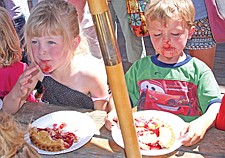 Leyton and Katelyn Hankins, of Polson, are quite shocked to find that the pie has ended up on their face during the kids' pie-eating contest at the Cherry Festival last weekend in Polson.