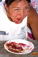 16-year-old Nina Orozco, of Polson, smiles while competeting in the adult pie-eating contest at the Cherry Festival last weekend in Polson.