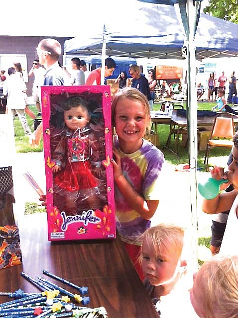 Kenia Orth and her new singing doll.