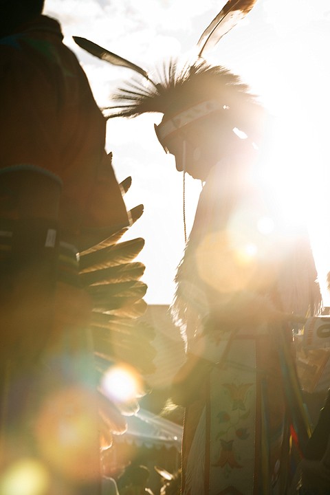 &lt;p&gt;SHAWN GUST/Press A Native American is wrapped in sunlight during
the Julyamsh grand entrance.&lt;/p&gt;