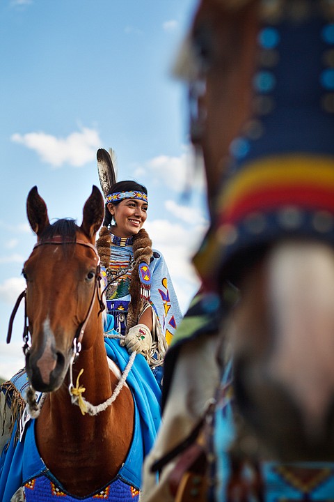 &lt;p&gt;Maya Best, a descendant of the Coeur d'Alene and Colville
tribes, smiles at family just before riding in a horse parade
kicking off the Julyamsh pow wow.&lt;/p&gt;