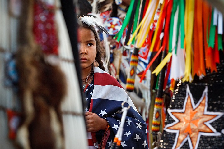 &lt;p&gt;Press Shelby Mustang, 6, of Keller, Washington, watches as
hundreds of Native American representing dozens of tribes from
around the country pass during the grand entrance.&lt;/p&gt;