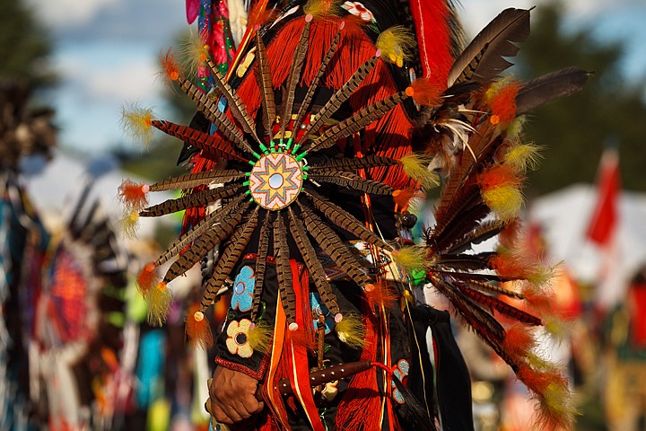 &lt;p&gt;SHAWN GUST/Press Warm evening sunlight accentuates the vibrant
colors of a Native American's traditional regalia.&lt;/p&gt;