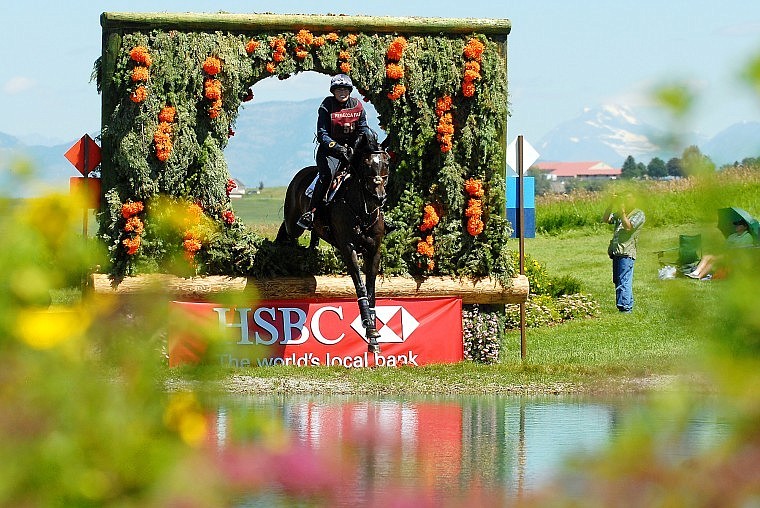 Gina Economou jumps through a wreath on Chaos Theory.