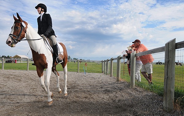 Olivia Cayley, 17, of Issaquah, Wash., practices with Scooter, a Quarter Horse Paint, before the Open Novice Dressage competition on Thursday at The Event at Rebecca Farm.