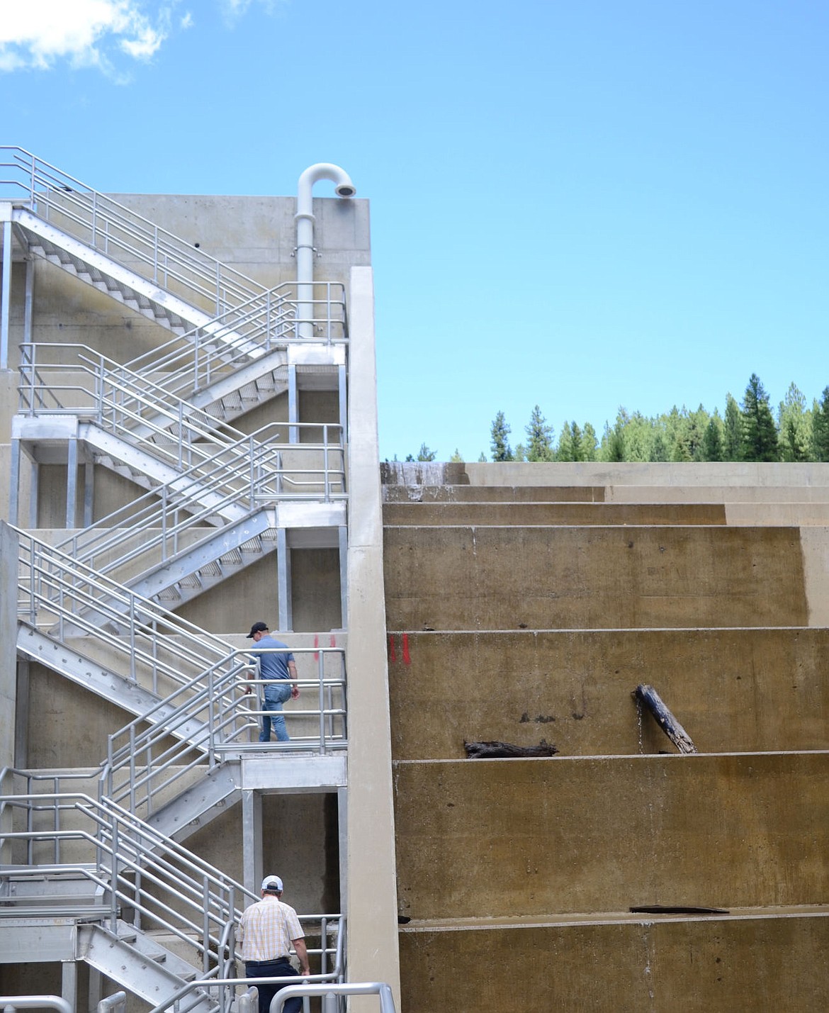 &lt;p&gt;Ryan Jones, above, and CR Leisinger, of Morrison-Maierle, climb the stairway on the Flower Creek Dam during Wednesday's tour. (Seaborn Larson/The Western News)&lt;/p&gt;