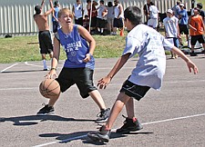 Casadt Wunderlich, of Ronan, faces up against Brayden Cutfinger, of Arlee, during the Good Old Days 3-on-3 basketball tournament last Saturday in St. Ignatius.