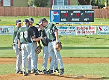 The Mariners B team huddle on the mound during a game this season.