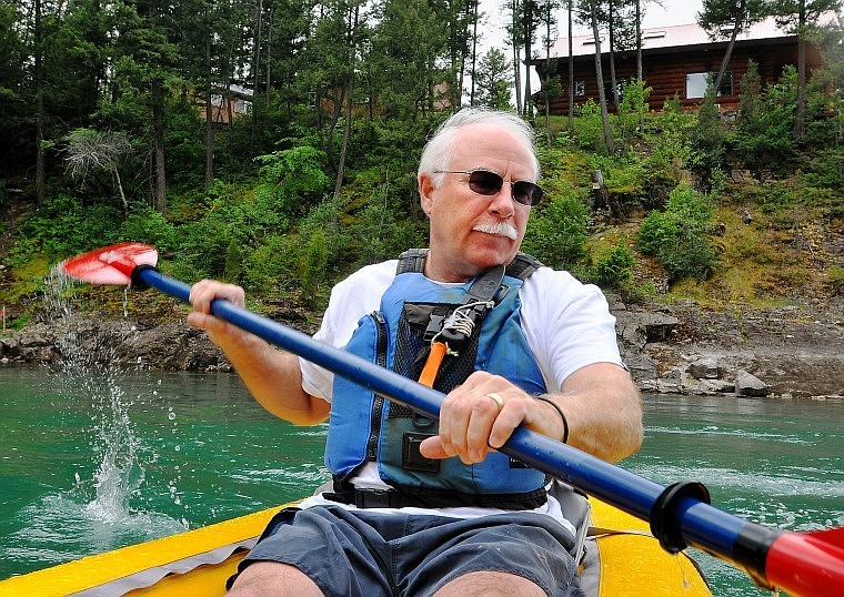 Craig Drynan kayaks along the Flathead River near his property. The proposed bridge would connect with Gamma Road, which is on the back side of Drynan&#146;s property.