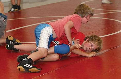 Nick Ianniello/Mineral Independent Josh Benda pins Tucker Smith during Superior Little Guy Wrestling Camp Thursday. Campers spent the week working on their take down technique.