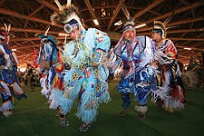 Teen grass dancers Dakota Gun Hammer, of St. Ignatius and Aaron Yazzie, of Ronan, dance during the Grand Entry Friday in Elmo.