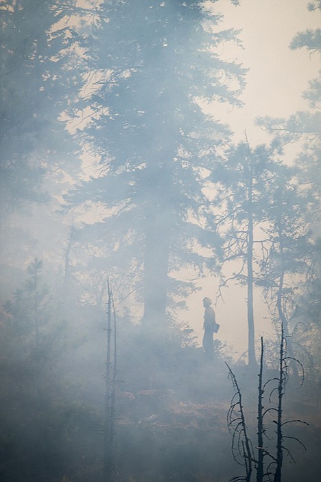 &lt;p&gt;Smoke fills the air where firefighters fight the nearly 10-acre blaze near Q'Emiln Park.&lt;/p&gt;