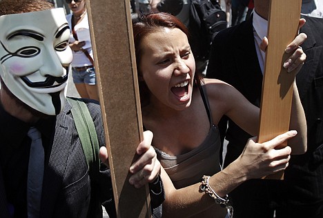 &lt;p&gt;Protesters shout slogans to demonstrate against the country's near 25 percent unemployment rate and stinging austerity measures introduced by the government, in Madrid, Spain, Saturday, July 21, 2012. (AP Photo/Andres Kudacki)&lt;/p&gt;