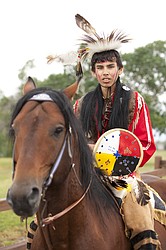 <p>Wyatt Madplume, 17, from Browning wears a traditional outfit during the parade at the North American Indian Days celebration on July 14.</p>