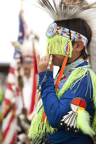 <p>James Rider, 11, watches others during the dance contest at the North American Indian Days celebration in Browning July 14. Rider says he has fun doing this because it is the Indian way and he enjoys getting out there and showing his your moves.</p>